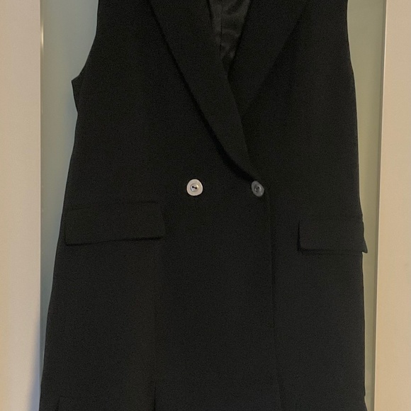Zara. Pretty black sleeveless waistcoat with fluted hem - Picture 1 of 8